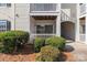 Image shows a ground floor unit with front door, sliding glass door and landscaping at 4024 Town Center Rd, Harrisburg, NC 28075