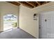 Condo patio showing door, unit number, and entry to outside at 4024 Town Center Rd, Harrisburg, NC 28075