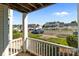 View from porch showing landscaping, parking lot and multiple units at 4024 Town Center Rd, Harrisburg, NC 28075
