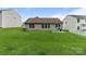 Backyard featuring green grass, a patio area and a partial privacy fence at 406 Courtland Ct, Kannapolis, NC 28081