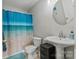 Bathroom featuring a shower curtain, large mirror, sleek sink and tiled floors at 406 Courtland Ct, Kannapolis, NC 28081