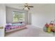Bedroom featuring a ceiling fan, a large window and carpeted floors at 406 Courtland Ct, Kannapolis, NC 28081