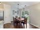Inviting dining area with hardwood floors, a sliding glass door, and a stylish light fixture at 406 Courtland Ct, Kannapolis, NC 28081