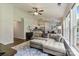 Bright living room featuring a plush sofa, abundant natural light, and contemporary decor for relaxation at 406 Courtland Ct, Kannapolis, NC 28081