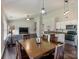 Open-concept living space featuring hardwood floors, natural light, and a seamless flow between kitchen and living areas at 406 Courtland Ct, Kannapolis, NC 28081