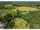 Expansive aerial shot of a charming home surrounded by lush greenery, offering a serene and private retreat at 4441 Jim Wise Rd, Lincolnton, NC 28092