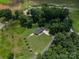 Stunning aerial view of a secluded home nestled among lush trees, showcasing its expansive yard and serene setting at 4441 Jim Wise Rd, Lincolnton, NC 28092