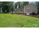 Large backyard showcasing well-maintained lawn, mature trees, and an inviting setting for outdoor activities at 4441 Jim Wise Rd, Lincolnton, NC 28092