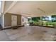 Extended carport offering a covered area, ideal for parking and outdoor entertainment with garden views at 4441 Jim Wise Rd, Lincolnton, NC 28092