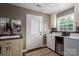 Functional laundry room with a sink, cabinets, washer, and dryer for convenient household tasks at 4441 Jim Wise Rd, Lincolnton, NC 28092