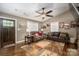 Comfortable living room features hardwood floors, a ceiling fan, and stylish seating, ideal for Gathering gatherings at 4441 Jim Wise Rd, Lincolnton, NC 28092
