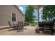 Outdoor patio featuring a dining set and grill, perfect for enjoying meals and relaxation outdoors at 4441 Jim Wise Rd, Lincolnton, NC 28092