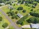 An overhead shot of a home surrounded by green trees, showcasing its location and a well-maintained property at 5211 Spring Gln, York, SC 29745