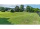 Spacious backyard with well-maintained lawn, trees, and partial fence at 5211 Spring Gln, York, SC 29745