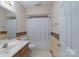 Bathroom featuring a bathtub with shower, vanity, mirror, and neutral color scheme at 5211 Spring Gln, York, SC 29745