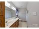Bathroom featuring a double vanity with a large mirror, bathtub/shower, and neutral tones at 5211 Spring Gln, York, SC 29745