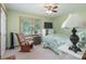 Cozy bedroom featuring a rocking chair, ceiling fan, and natural light from the window at 5211 Spring Gln, York, SC 29745