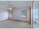 Bright bedroom with two windows, ceiling fan, and neutral carpet at 5211 Spring Gln, York, SC 29745
