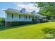 Beautiful home with a full front porch, dormer windows and luscious green lawn at 5211 Spring Gln, York, SC 29745