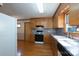 Kitchen view featuring wood cabinets, countertops, hardwood floors and appliances at 5211 Spring Gln, York, SC 29745