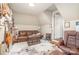 Cozy finished attic with a brown leather sofa and decorative guitar displays at 5537 Challis View Ln, Charlotte, NC 28226