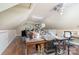 Spacious unfinished attic featuring slanted ceilings and wood floors at 5537 Challis View Ln, Charlotte, NC 28226