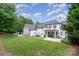 Expansive backyard with a stone patio perfect for outdoor entertaining and grilling at 5537 Challis View Ln, Charlotte, NC 28226
