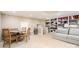Finished basement offers a dining area, shelving, and comfortable seating at 5537 Challis View Ln, Charlotte, NC 28226