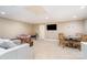 Basement showcasing a sofa, desk, television, and a dining table with chairs at 5537 Challis View Ln, Charlotte, NC 28226