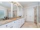 Bathroom featuring double sinks with granite countertops, tile flooring, and walk-in shower at 5537 Challis View Ln, Charlotte, NC 28226