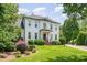 Beautiful white home featuring manicured front lawn at 5537 Challis View Ln, Charlotte, NC 28226