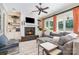 Cozy living room with fireplace, built-in bookshelves, large windows, and comfortable seating at 5537 Challis View Ln, Charlotte, NC 28226