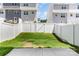 Backyard features white vinyl fence, grass area, and concrete patio at 5690 Granbury Dr, Kannapolis, NC 28081