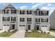 Charming townhomes showcase appealing exteriors with individual garages and inviting front entrances at 5690 Granbury Dr, Kannapolis, NC 28081