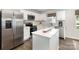 Kitchen featuring stainless steel appliances, white cabinets, and hardwood floors at 5690 Granbury Dr, Kannapolis, NC 28081