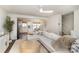 Open concept living room with a view of the kitchen and hardwood floors at 5690 Granbury Dr, Kannapolis, NC 28081