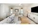 Bright living room with a large sectional sofa, and a mounted flat screen television at 5690 Granbury Dr, Kannapolis, NC 28081