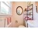 This bathroom has towels on a towel bar near the window and a sink with storage at 701 Mcswain Rd, Shelby, NC 28150