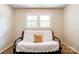 Neutral bedroom with futon and a large window, creating a comfortable and inviting space at 701 Mcswain Rd, Shelby, NC 28150