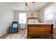 Comfortable bedroom with carpet, a ceiling fan and a mirror at 701 Mcswain Rd, Shelby, NC 28150