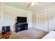 This bedroom features neutral walls, plush carpeting, and a ceiling fan for added comfort at 701 Mcswain Rd, Shelby, NC 28150