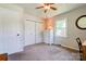 This bedroom has neutral walls, carpet and features a dresser and closet for ample storage at 701 Mcswain Rd, Shelby, NC 28150
