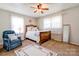 Cozy bedroom with carpet, ceiling fan and white curtains at 701 Mcswain Rd, Shelby, NC 28150