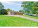 Well-maintained home with a brick exterior, front lawn, and a paved driveway leading to the property at 701 Mcswain Rd, Shelby, NC 28150