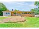 Charming brick home featuring a cozy front porch and lush green lawn at 701 Mcswain Rd, Shelby, NC 28150