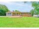 Charming single-story home featuring a brick facade, manicured lawn, and lush landscaping at 701 Mcswain Rd, Shelby, NC 28150