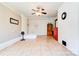 Bright and open living room with tile flooring and white brick accent wall at 701 Mcswain Rd, Shelby, NC 28150