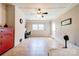 Spacious room with brick accents, ceiling fan, large windows and tiled floor at 701 Mcswain Rd, Shelby, NC 28150