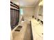 Bathroom with a tub, tile flooring and dual sinks offering a relaxing retreat at 7010 Executive Cir, Denver, NC 28037