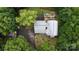 Aerial view of private wooded lot and the home with stone patio, fire pit and three car garage at 720 Potneck Rd, Salisbury, NC 28147
